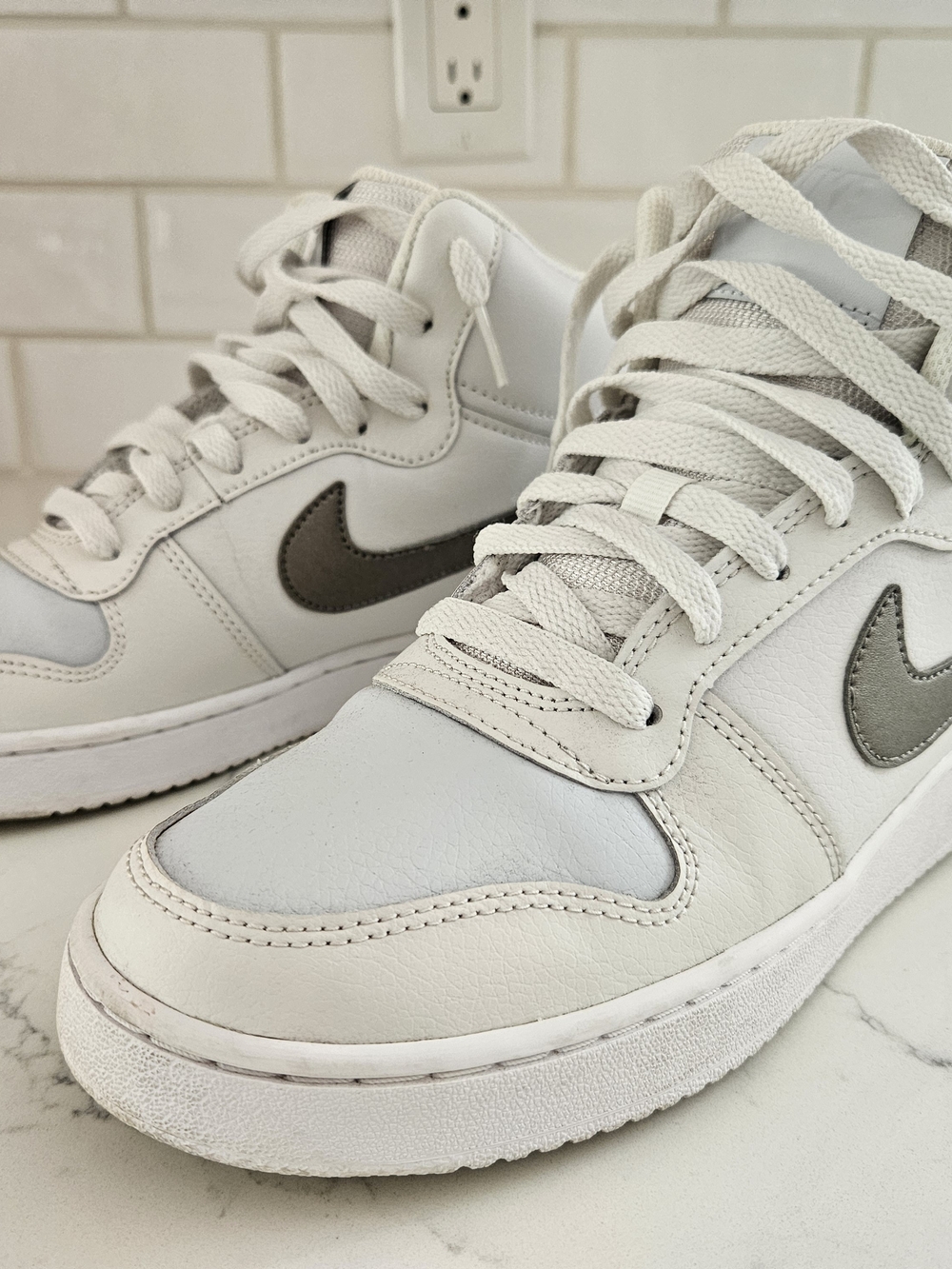 Nike Women's White Leather High-Top Sneakers with Grey Swoosh